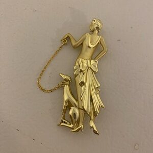 Vintage Elegant Gold Brooch with Woman and Dog Design